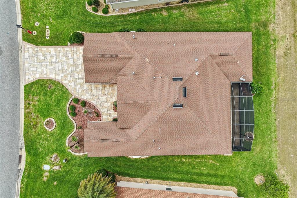 3522 Arlington Ridge Boulevard Leesburg, FL 34748 - Photo 36 of 43 an aerial view of a house with a garden and trees