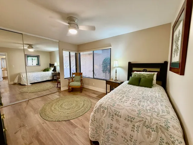 a bedroom with a large bed and couch