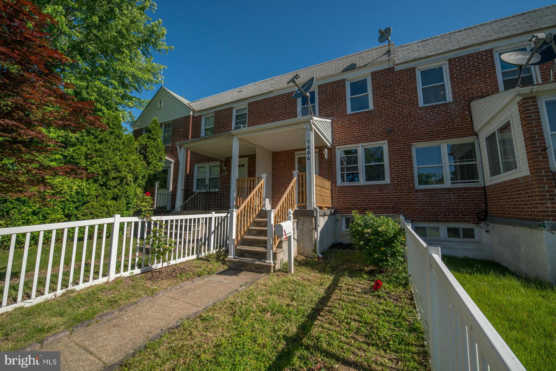 7404 Kirtley Road Baltimore, MD 21222 - Photo 1 of 13 a front view of a house with a yard