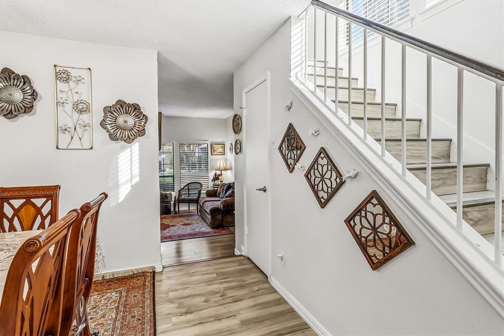 15151 Berry Trail, Unit 1307 Dallas, TX 75248 - Photo 5 of 27 Stairs featuring wood finished floors and baseboards