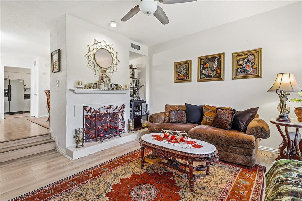 15151 Berry Trail, Unit 1307 Dallas, TX 75248 - Photo 7 of 27 Living area with a ceiling fan, wood finished floors, recessed lighting, and a tile fireplace