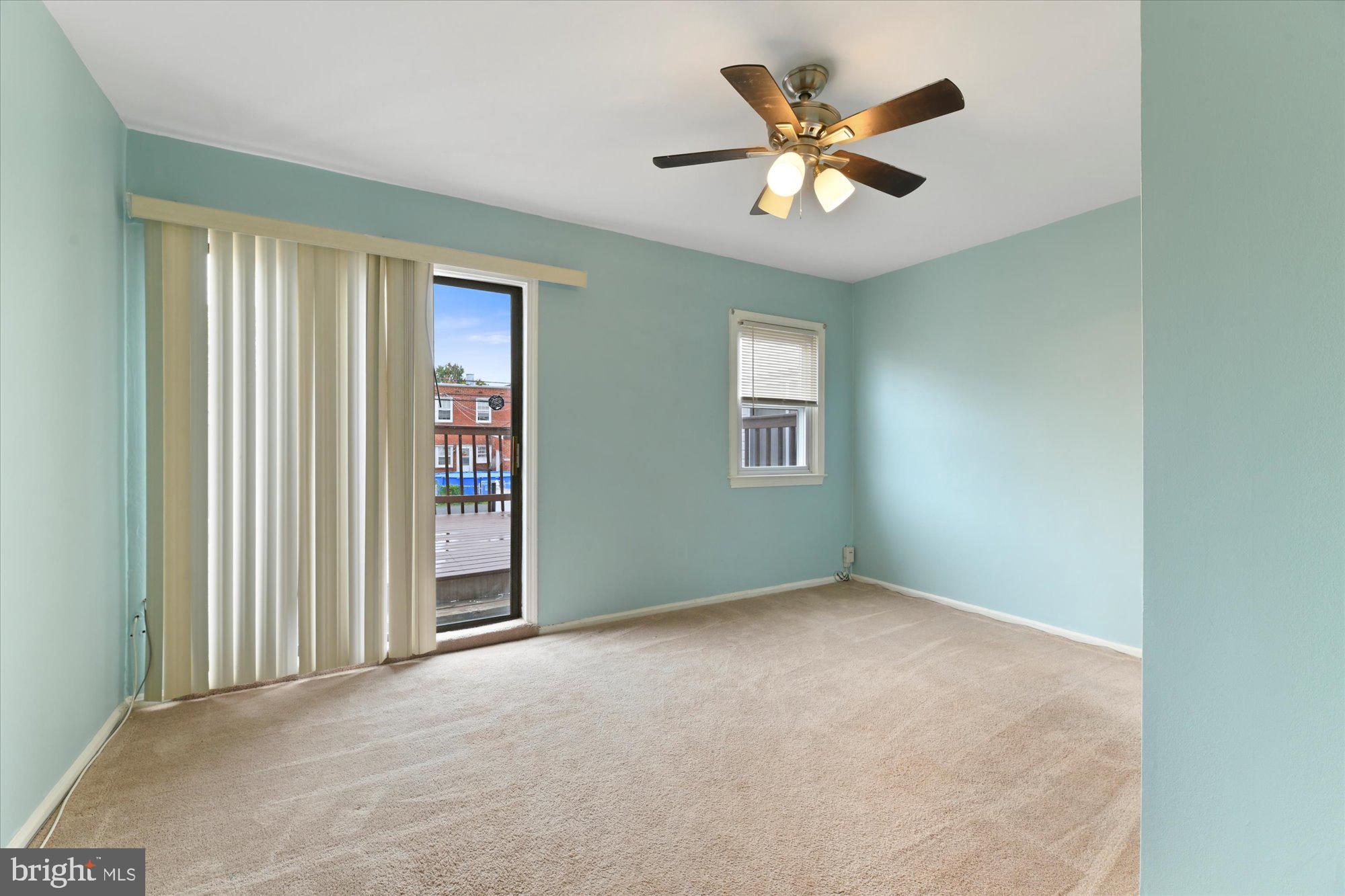 8051 Gray Haven Road Baltimore, MD 21222 - Photo 7 of 24 Main level bedroom with deck access