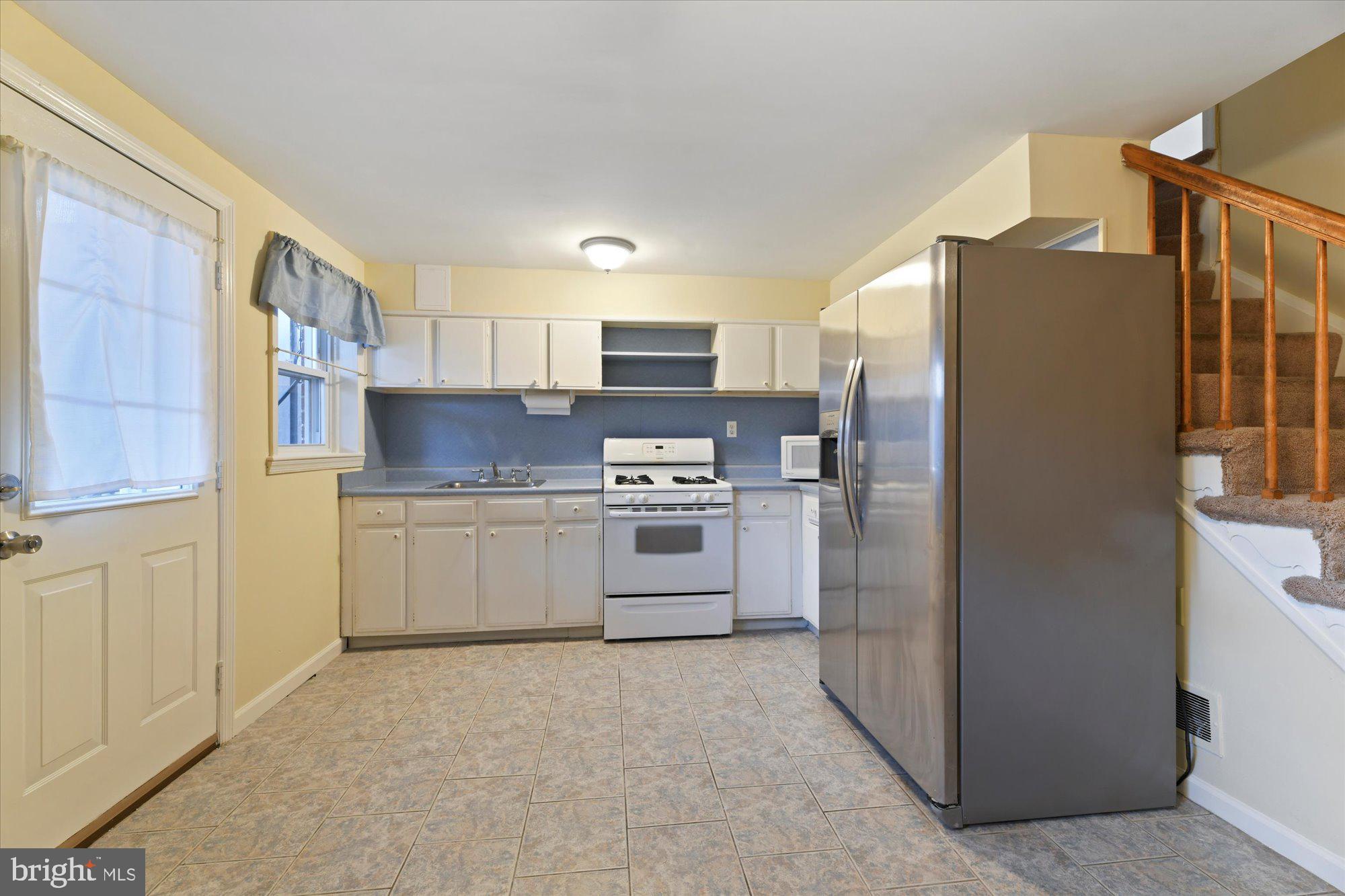 8051 Gray Haven Road Baltimore, MD 21222 - Photo 9 of 24 Lower level spacious kitchen
