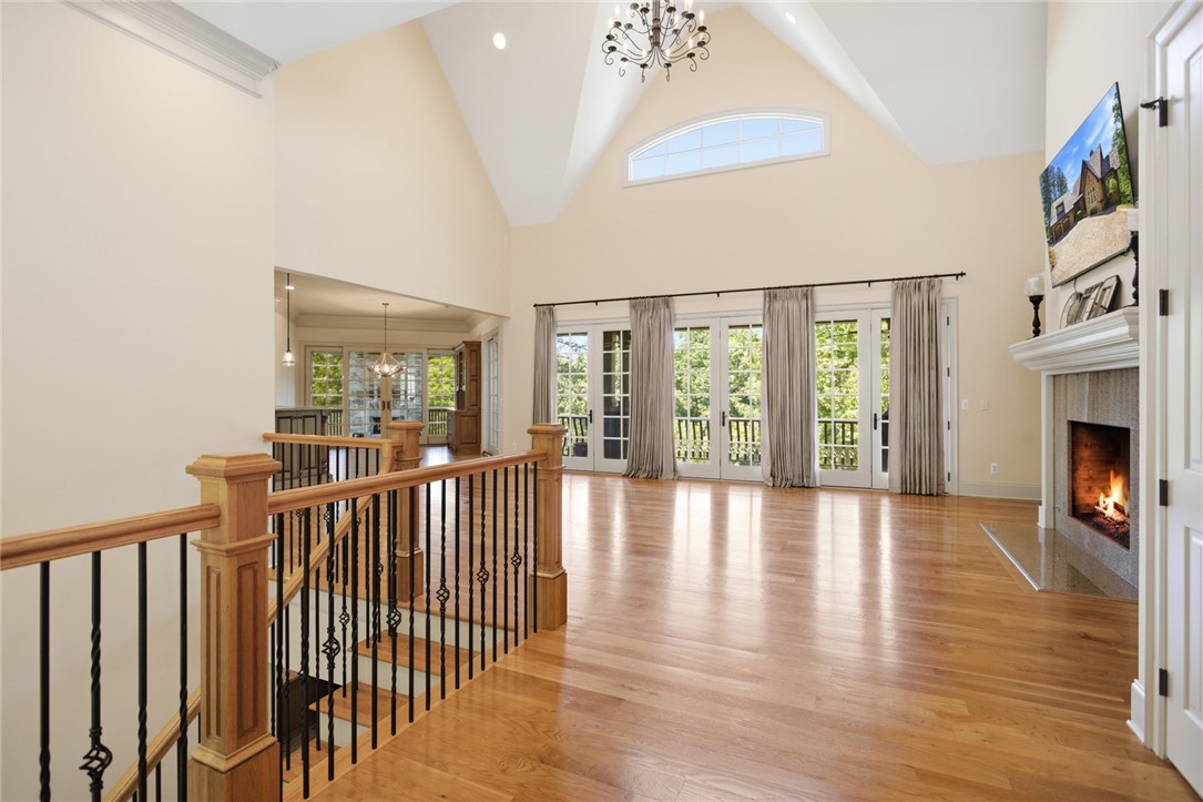 130 River Ridge Road Sunset, SC 29685 - Photo 3 of 47 Grand living area with vaulted ceilings and a warm fireplace, perfect for gatherings.