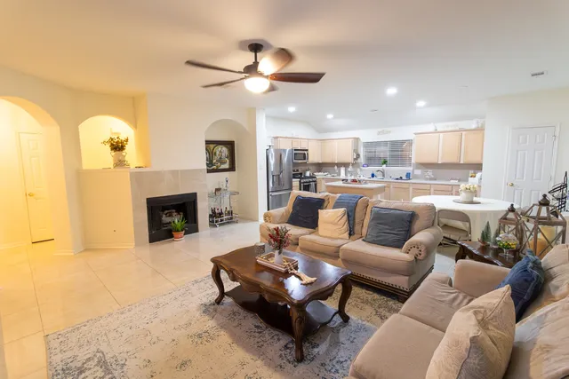 a living room with furniture and a fireplace