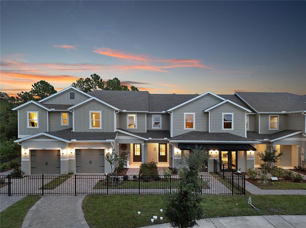 16639 Luminary Loop Clermont, FL 34714 - Photo 2 of 26 a front view of a house with a yard