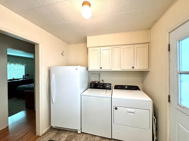 a bathroom with a double vanity sink mirror and shower