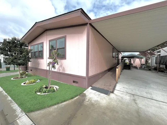 a living room with fireplace furniture and a flat screen tv