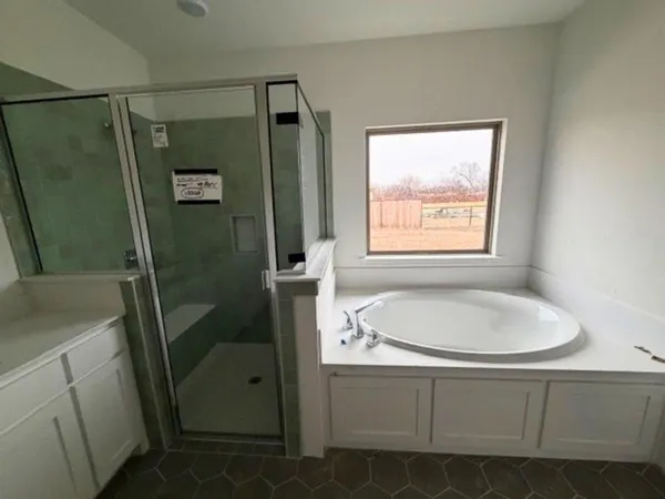 a bathroom with a sink a toilet a shower a toilet and vanity