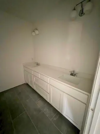 a room with a sink and vanity