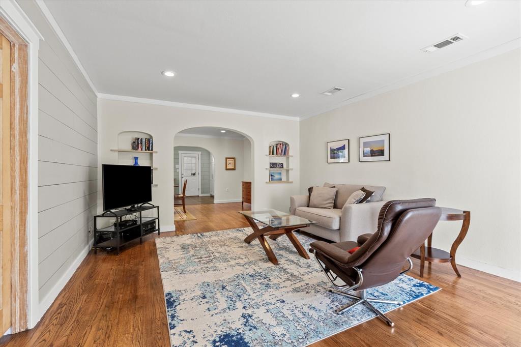 2919 Maple Springs Boulevard Dallas, TX 75235 - Photo 15 of 26 a living room with furniture and a flat screen tv