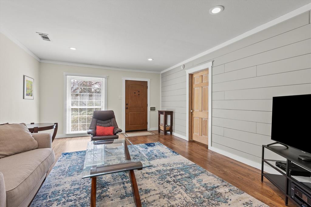 2919 Maple Springs Boulevard Dallas, TX 75235 - Photo 16 of 26 a living room with furniture and a flat screen tv