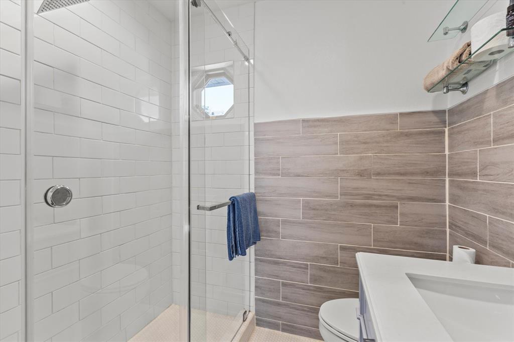 2919 Maple Springs Boulevard Dallas, TX 75235 - Photo 20 of 26 a bathroom with a toilet and shower