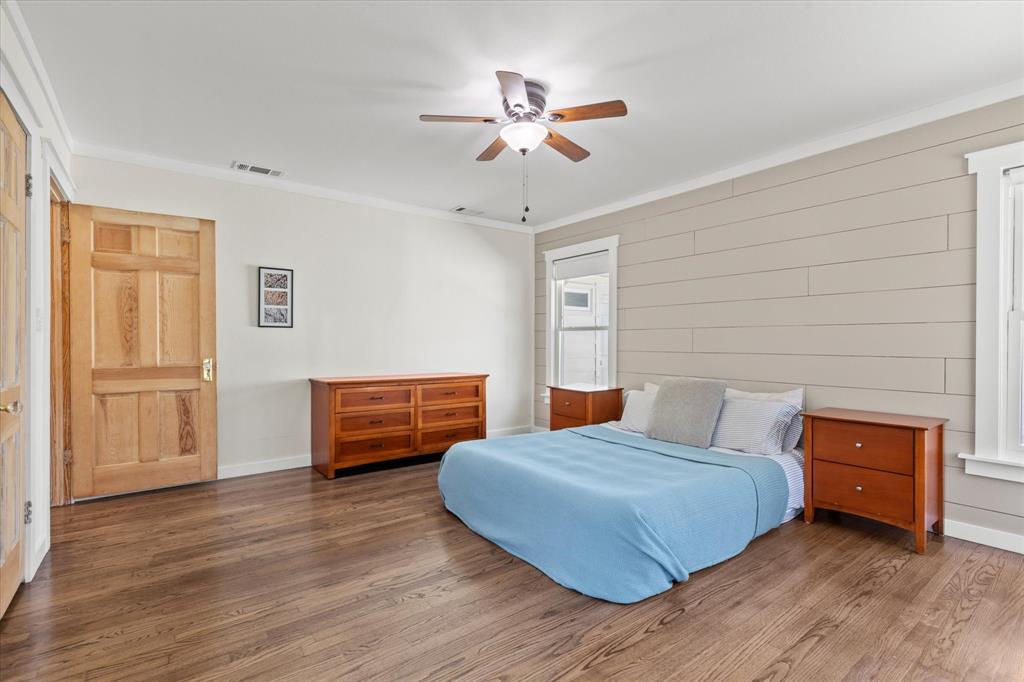 2919 Maple Springs Boulevard Dallas, TX 75235 - Photo 26 of 26 a bedroom with furniture and wooden floor