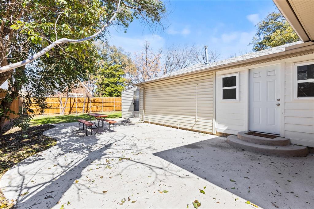 2919 Maple Springs Boulevard Dallas, TX 75235 - Photo 7 of 26 a view of a backyard with large trees