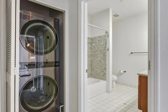 a view of a building with a dining table and chairs