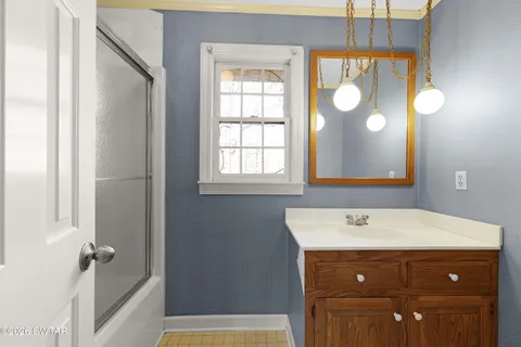 a bathroom with a sink and a mirror