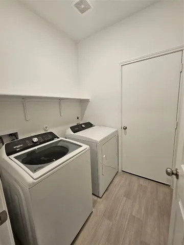 a view of an empty room with racks on the wall