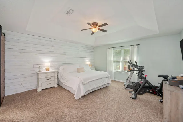 a room with a bed and furniture