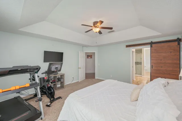 a bedroom with a bed and a table