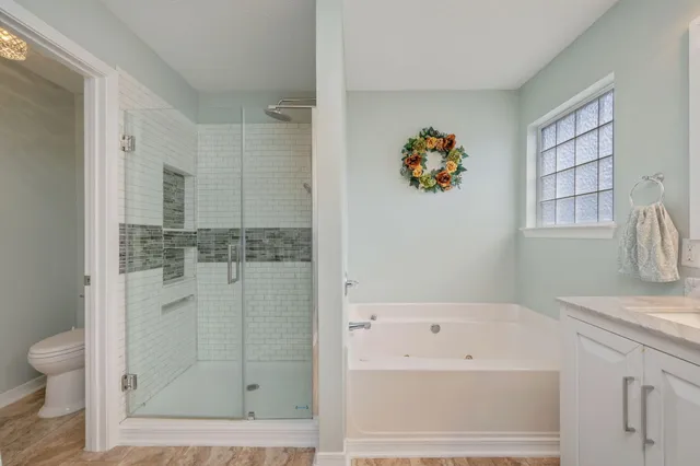 a bathroom with a bathtub sink and toilet