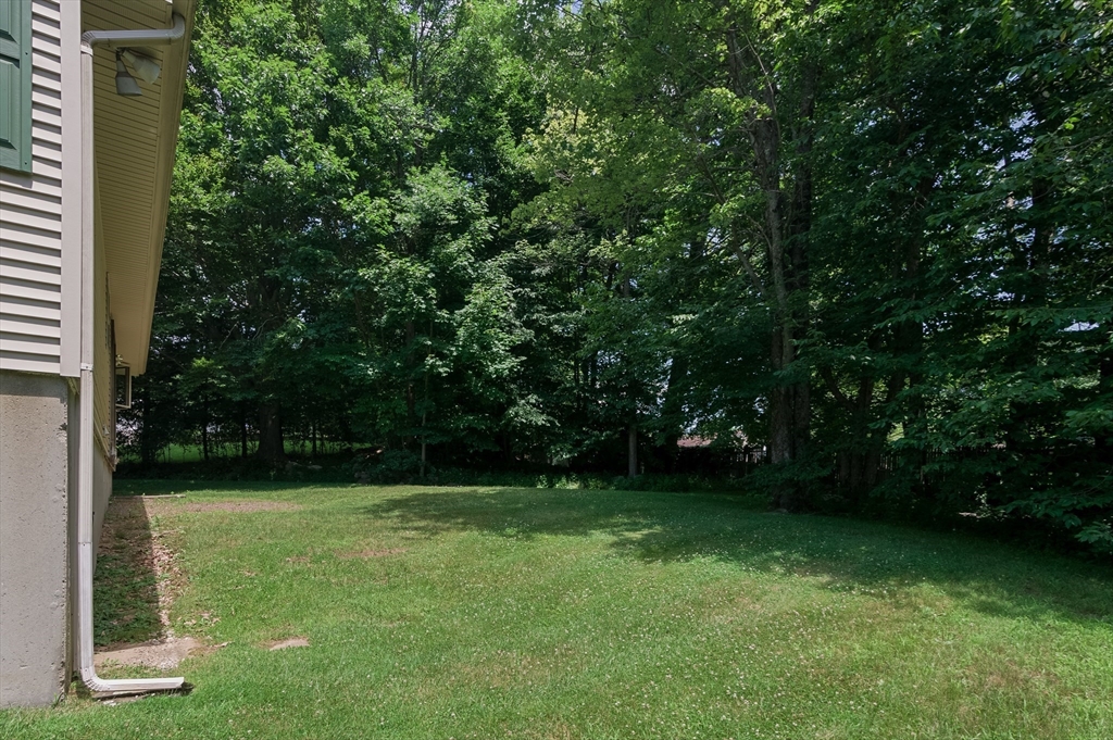 35 Juniper Lane Rutland, MA 01543 - Photo 13 of 15 a view of green field with trees in the background
