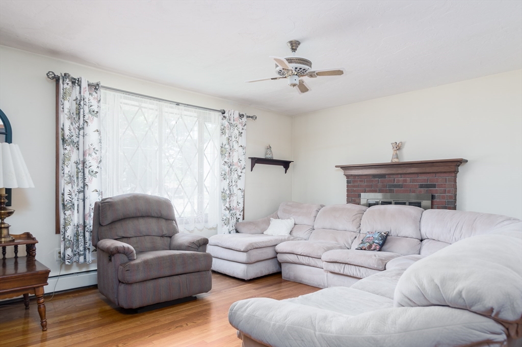 35 Juniper Lane Rutland, MA 01543 - Photo 5 of 15 a living room with furniture and a chandelier