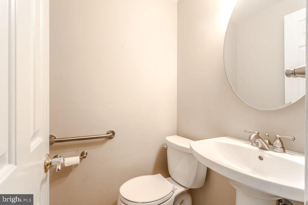 324 Wayland Road Cherry Hill, NJ 08034 - Photo 16 of 28 a bathroom with a toilet sink and mirror