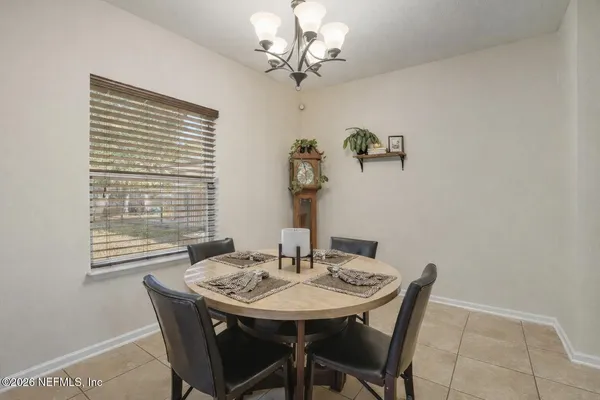 a kitchen with stainless steel appliances granite countertop a sink and a refrigerator
