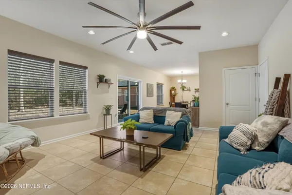 a dining room with furniture and window