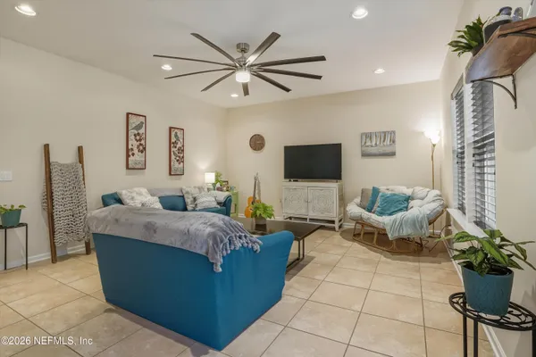 a living room with furniture and a large window