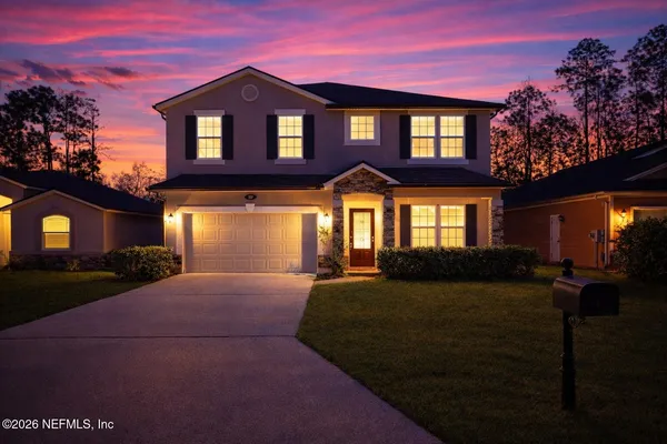a front view of a house with a yard