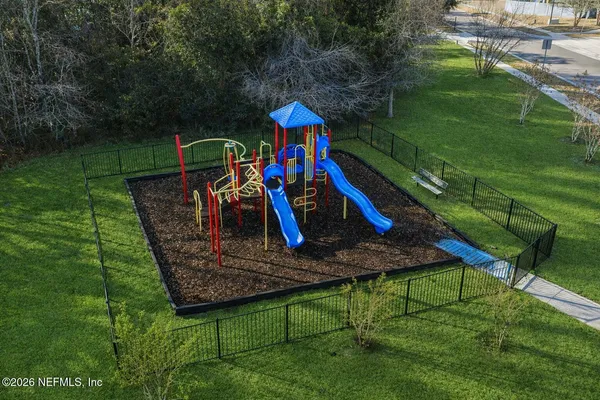 a childrens park with lots of swings and slides