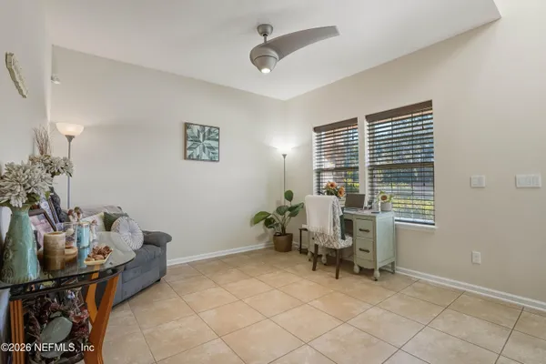 a bedroom with furniture and a window