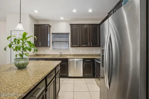 a bedroom with a bed and a television