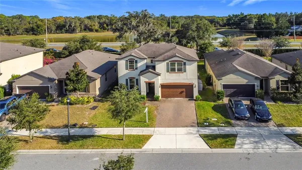 a aerial view of a house with swimming pool and a outdoor space