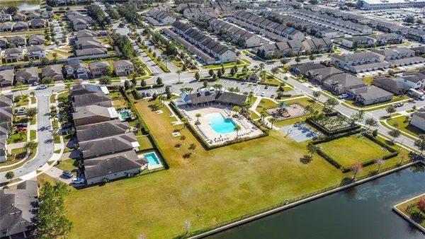 an aerial view of residential houses with swimming pool