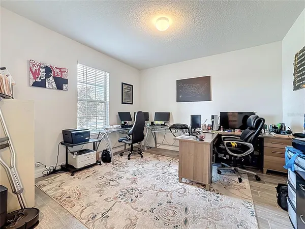 a workspace with furniture and a window