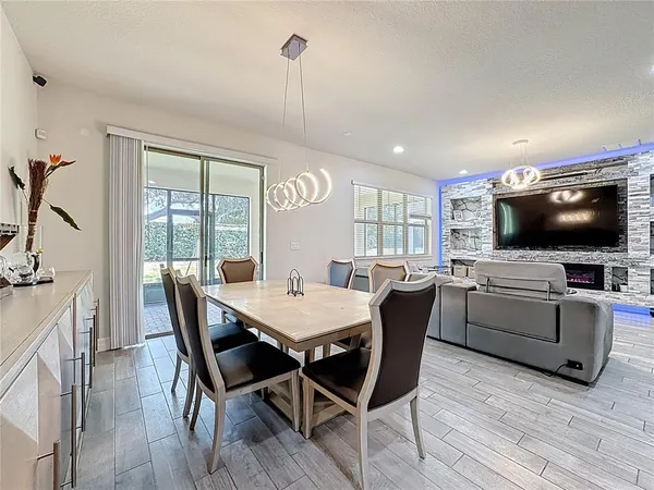a view of a dining room with furniture window and wooden floor