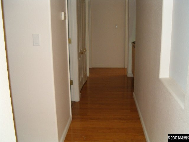 2180 Evergreen Reno, NV 89521 - Photo 3 of 9 a view of a hallway with wooden floor