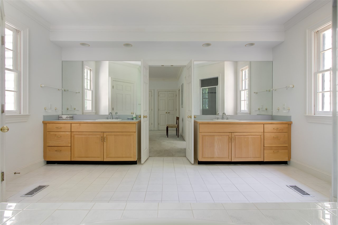10 Pearse Wynd Road Bahama, NC 27503 - Photo 15 of 29 a bathroom with a double vanity sink and mirror
