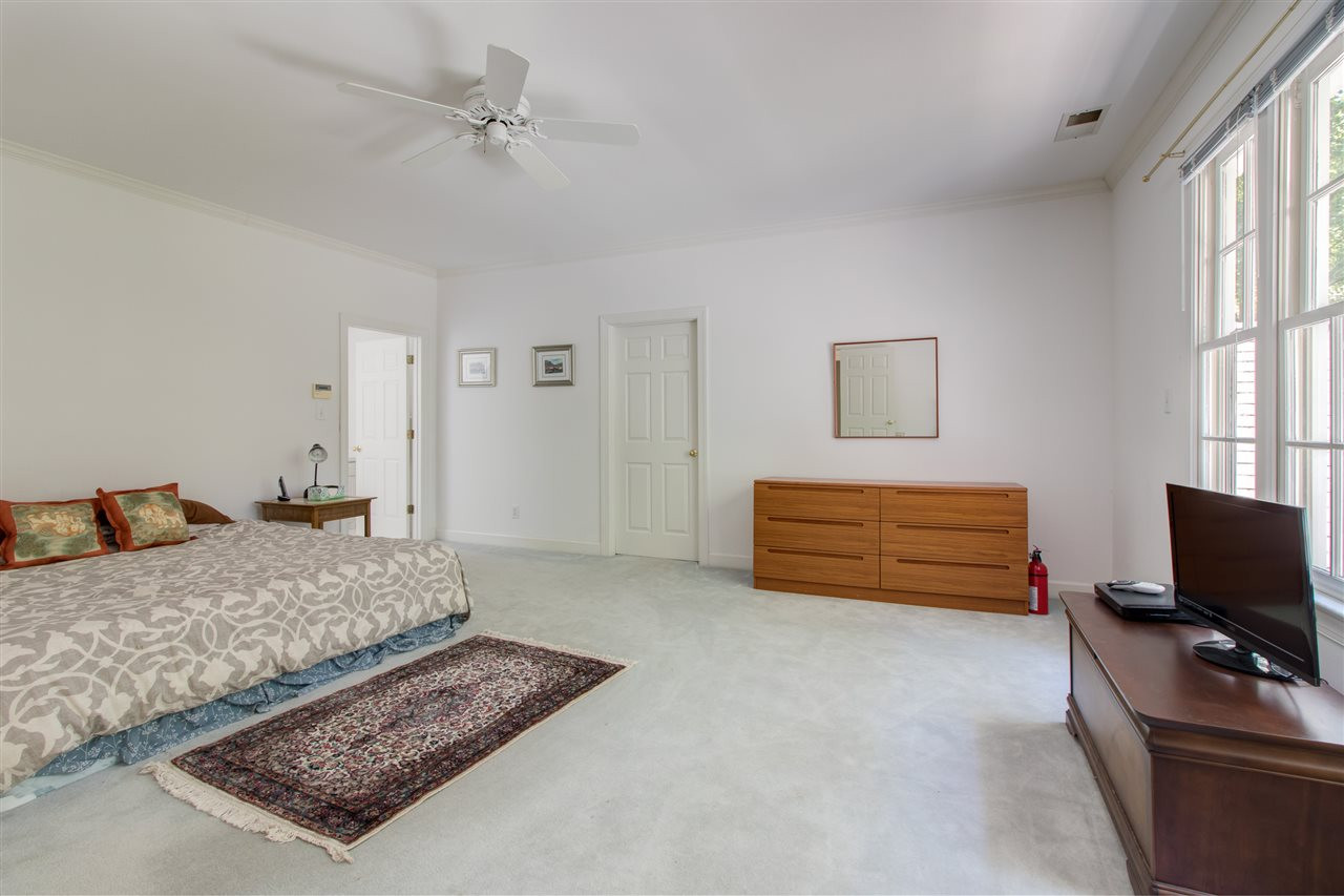 10 Pearse Wynd Road Bahama, NC 27503 - Photo 17 of 29 a bedroom with a bed and a flat screen tv