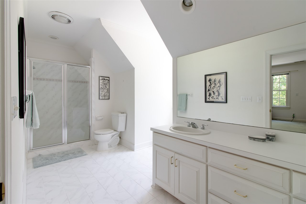 10 Pearse Wynd Road Bahama, NC 27503 - Photo 19 of 29 a spacious bathroom with a double vanity sink toilet and a mirror