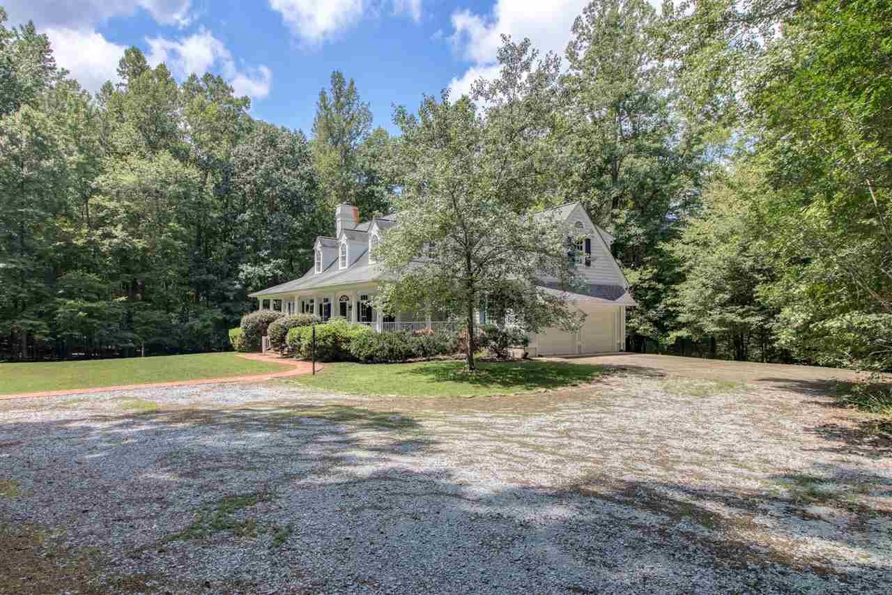 10 Pearse Wynd Road Bahama, NC 27503 - Photo 2 of 29 a view of a house with yard and basketball court