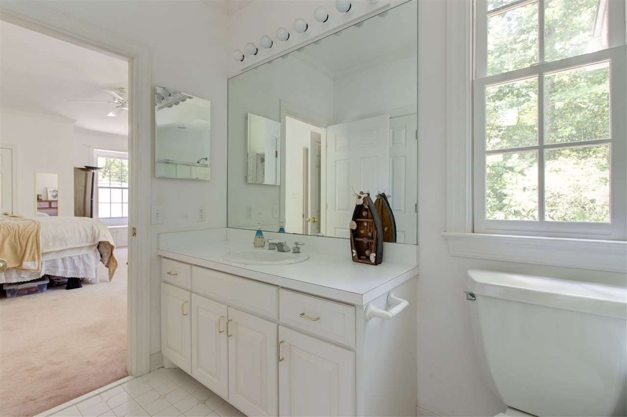 10 Pearse Wynd Road Bahama, NC 27503 - Photo 25 of 29 a en suite bathroom with a toilet sink and mirror