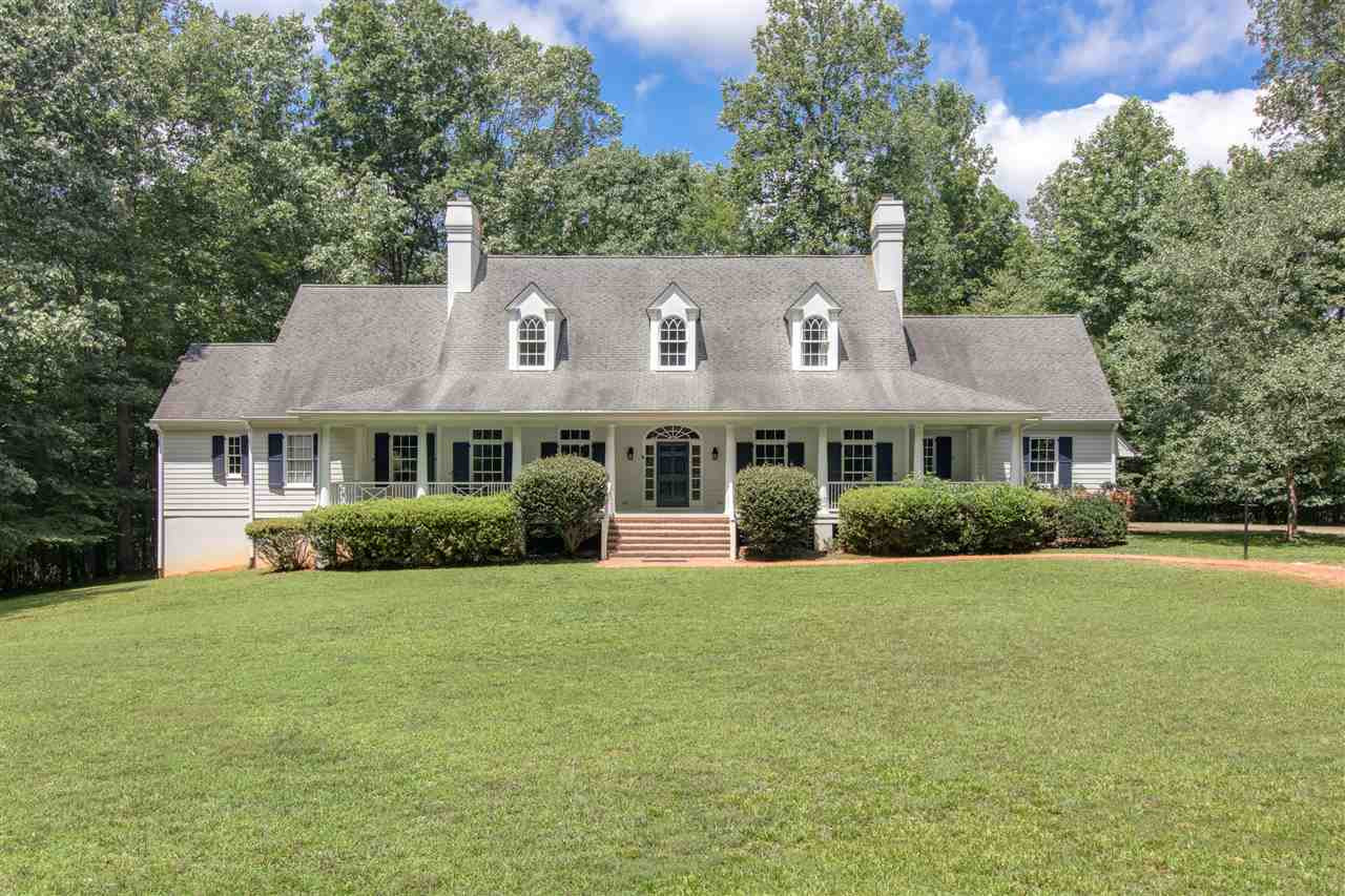10 Pearse Wynd Road Bahama, NC 27503 - Photo 3 of 29 a front view of a house with a yard and trees