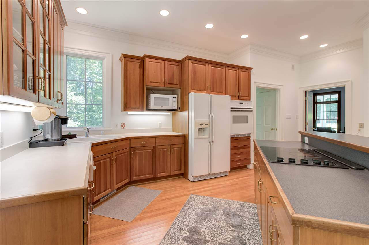 10 Pearse Wynd Road Bahama, NC 27503 - Photo 8 of 29 a kitchen with refrigerator a stove a sink and dishwasher