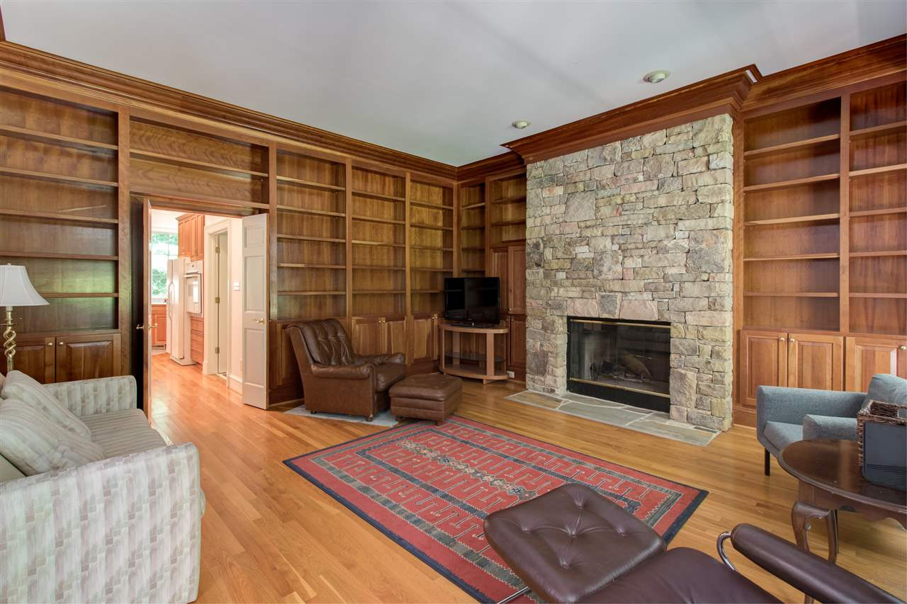 10 Pearse Wynd Road Bahama, NC 27503 - Photo 9 of 29 a living room with furniture a rug and a fireplace