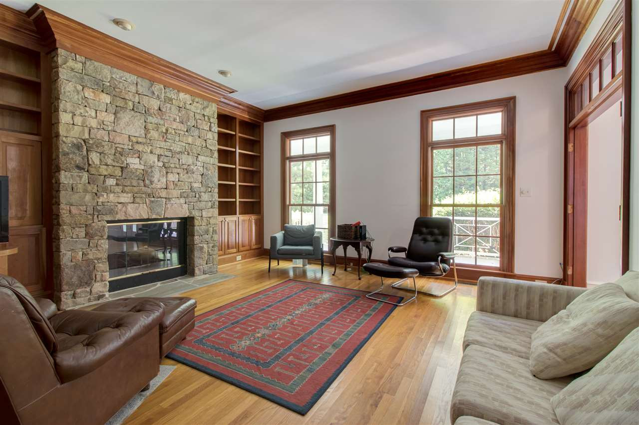 10 Pearse Wynd Road Bahama, NC 27503 - Photo 10 of 29 a living room with furniture windows and a fireplace