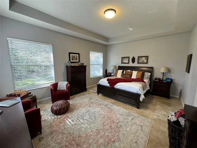 a bedroom with a bed and a couch